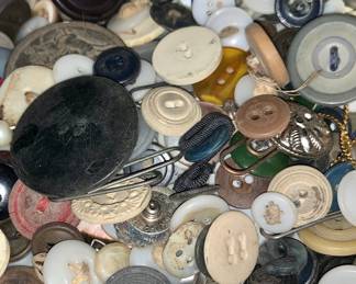 1 little tin of buttons.  We love old buttons.  We have found bags and bags of old buttons. 