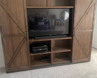 Sliding door cabinet to hide tv. 