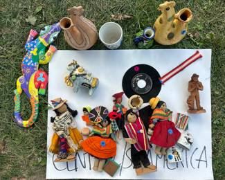 South American dolls, pottery, painted wood lizard (items from Honduras, Ecuador, Peru)