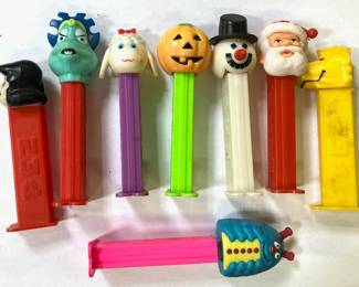 Eight (8) Pez Containers
