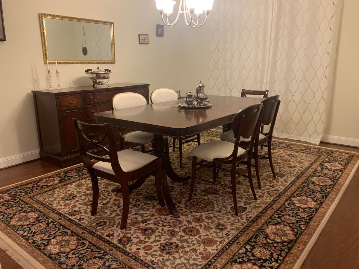 Solid wood dining room with middle leaf extension.