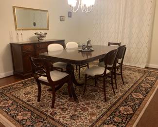 Solid wood dining room with middle leaf extension.