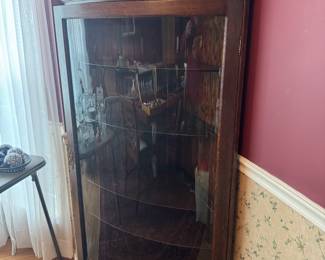 Antique Oak with curved glass door, 5 tiered, corner cabinet (23"W x 23"D x 66"H)