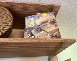 collection of miniature vintage sewing machines