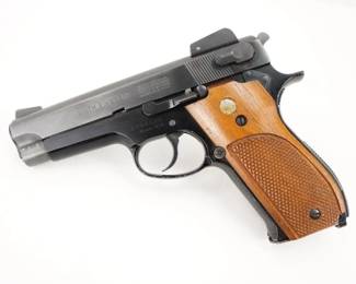 Make: Smith & Wesson
Model: 439
Caliber: 9mm
Action: Semi
Barrel: 4
Bore: Shiny
Serial # A764588
Condition: Excellent
The Smith & Wesson 439 is the second generation of the Smith & Wesson 39. Traditional double-action 9x19mm caliber pistol. The alloy frame and steel slide version of the all steel (blued & nickel) Smith & Wesson 539 and stainless steel Smith & Wesson 639. Eight shot magazine, 4 inch barrel, blue or nickel finish. Manufactured with both adjustable rear sights and fixed-sight. The pistol is in very good condition showing normal signs of use and wear.