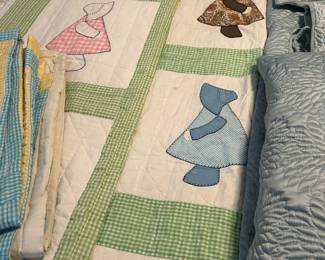 Two handmade sun bonnet quilts