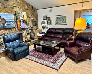 Very comfy leather sofa & matching chair, area rug & nice glass top coffee table