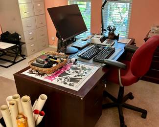 Very nice office desk and lots of office supplies 