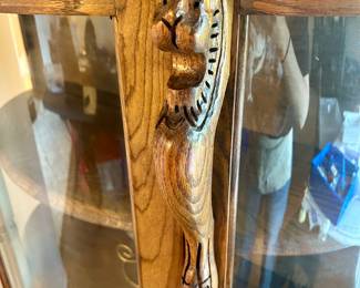 Check out the lion detail on this curio cabinet 