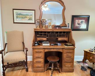 English Baroque chair, antique oak roll top desk with mirror, organ stool, John Kollock print on wall.