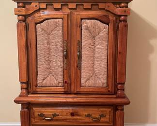 Pine armoire with woven rattan doors