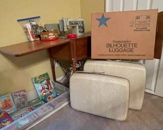 Vintage Sears Kenmore sewing machine in cabinet, children's books, 2 pieces vintage Samsonite Silhouette luggage.  