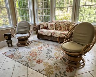 Nice wicker sofa and two rattan swivel rockers, fun rug!
