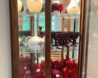 Top shelf: Murano glass, second shelf: Avon Ruby glass, third shelf: "L E Smith Moon and Stars Amberina and Ruby" glass