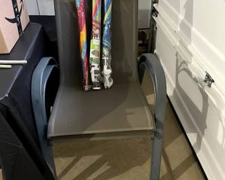                    Pair of stacking chairs and chair umbrellas