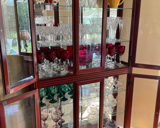 Glass curio/glassware display case - lit with Waterford, and vintage glassware