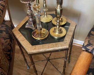 Metal and fossil stone side table with brass and glass candle holders