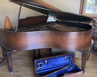 Hardman Peck baby grand piano and vintage Trombone