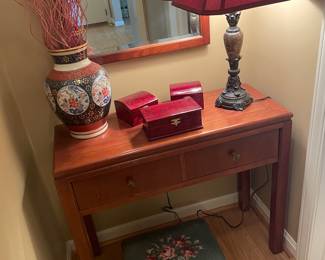 Console table by Heckman, Asian storage boxes and vase, needlepoint foot still and brass and stone lamp
