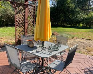 Square patio table with 4 rocker chairs and umbrella