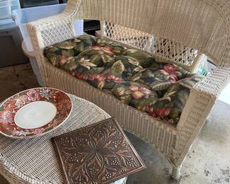White wicker settee and cocktail table