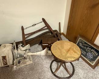 Apache outboard boat motor, vintage bentwood cane side table, antique 2 man lumberjack saws, primitive double handle harp bow tree saw, Pabst Blue Ribbon mirror