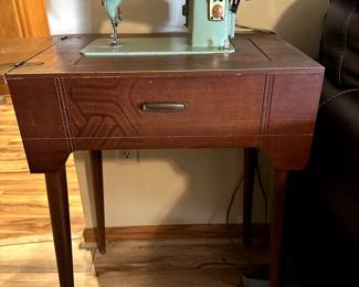 Vintage mint green Singer sewing machine and sewing table