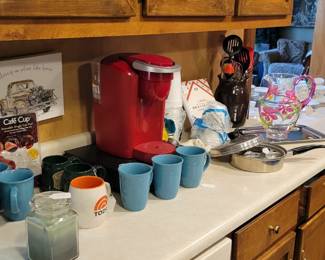 Coffee maker and blue mugs