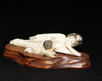 Carved Asian lady and man