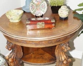 Lion head carved wood table