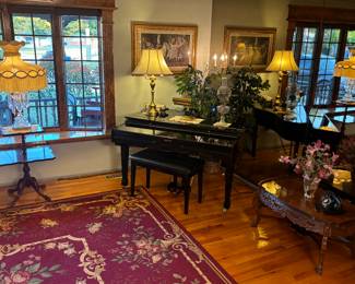 Antique crystal lamp, area rug, Suzuki electric baby grand piano, antique coffee table and phone