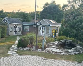 Small houses on the back of the property packed with wood, antiques, garden tools, and lots of Christmas items!
