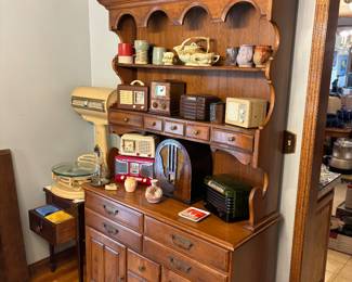 Very nice hutch, antique radios, pottery, antique table, scale