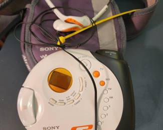 Sony walkman with earphones and case
