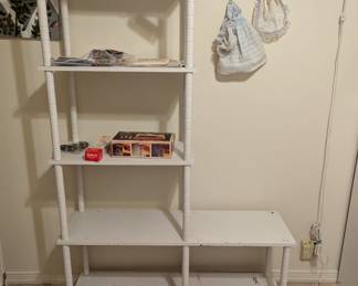 $80 - White Wood Spindle Bookcase - 31.5" bottom right side, 12" deep, 63.25" tall / 24" wide bottom left side, 12" deep, 18.5" tall. 