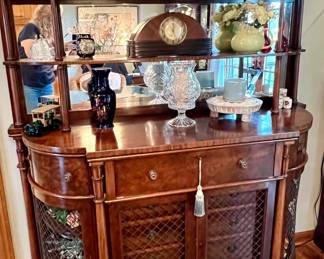 Antique buffet with metal lattice doors and mirrored hutch