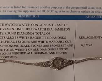 Ladies Hamilton Watch contains 22 grams of platinum movement included. 68 white round diamnonds. Appraised at $4327.65 in June 2024 by Fountain City Jewelers