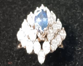 Ladies vintage diamond and sapphire ring. 7.2 grams of 18kt white gold with 3/4 carot natural blue marquise cut sapphire. 22 natural marquise shape white diamonds 3 cts. Appraised in June of 2024 at $5875 at Fountain City Jewelers.