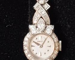 Ladies Hamilton Watch contains 22 grams of platinum movement included. 68 white round diamnonds. Appraised at $4327.65 in June 2024 by Fountain City Jewelers