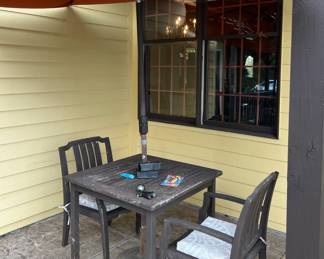 Wood table and chairs with umbrella