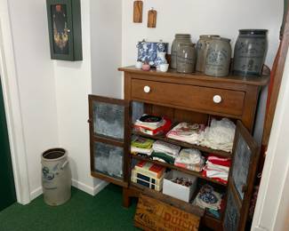 Pie safe cabinet. Stoneware crocks, linens, ceramicware