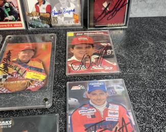 Many autographed racing cards