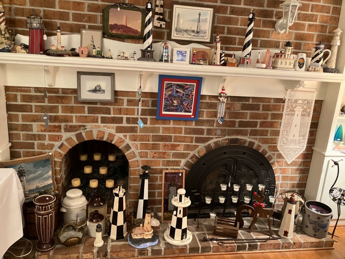 Large lighthouse collection to include artwork throughout the room, not seen in photo 