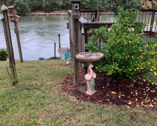 Assortment of yard decor and bird houses
