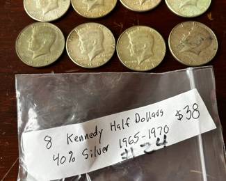 #24	8 kennedy half dollars 40 % silver 1965-70	 $38.00 
