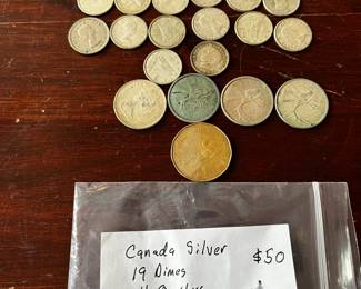 #27	Canada silver 19 dimes 4 quarters 1 loon non silver coins	 $50.00 
