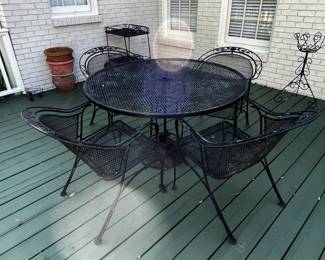 #195	Black Wrought Iron table w/4 Chairs (wide barrel back) - 47" Round x 28" Tall w/umbrella Stand	 $125.00 
