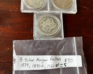 #25	3 silver Morgan dollars 1879,1891-0 1921	 $90.00 
