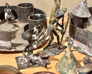 Rare Collection of African Artifacts Found Behind a Wall in an old house in Atlanta many years ago. The collection Includes rare pieces such as African Currency Bracelets and hand made metal figures.