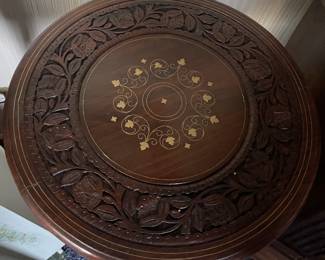 Carved Table with brass insert